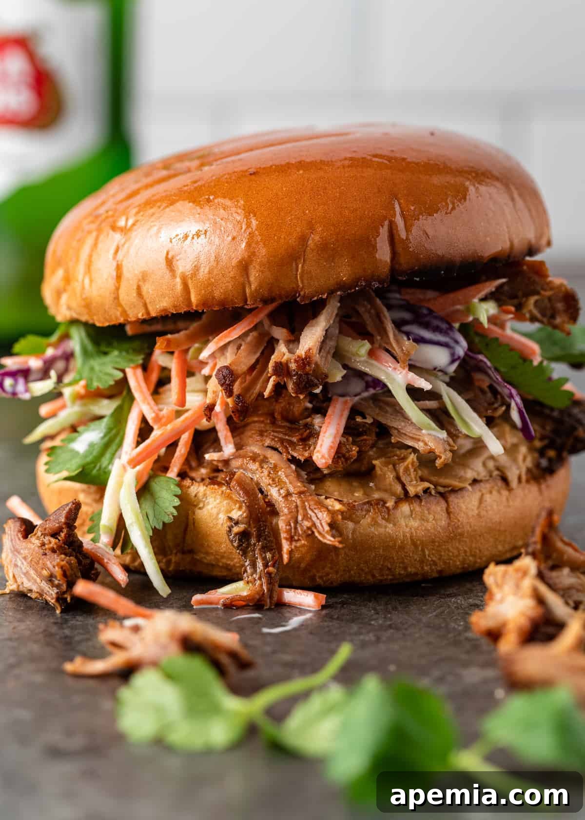 asian pulled pork slider topped with creamy coleslaw