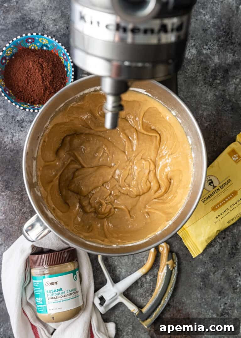 Process shot: Mixing tahini brownie batter in a stand mixer.