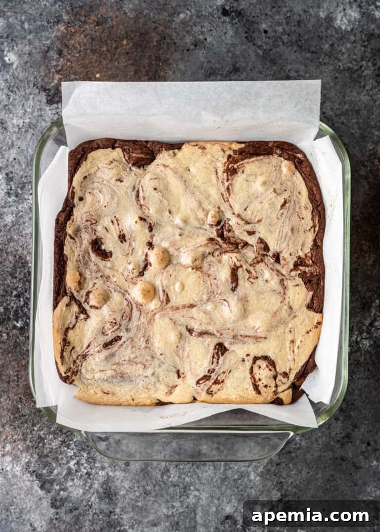 Process shot: A pan of swirled tahini brownies freshly out of the oven, cooling down.