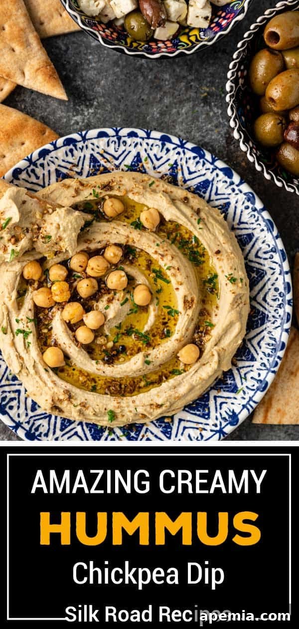 A visually stunning Pinterest image showcasing amazing creamy hummus chickpea dip in a bowl.