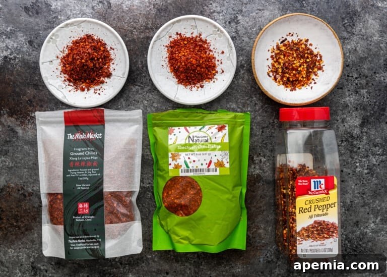 overhead: three packages and dishes of different spicy red chiles