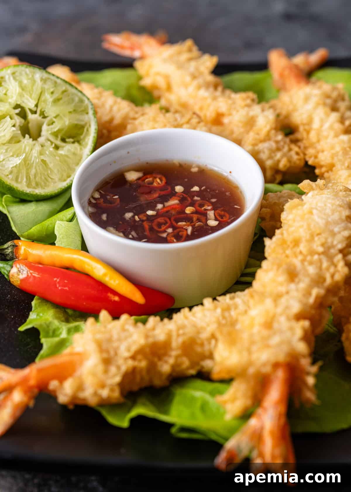 nuoc cham sauce in a white ramekin with crispy shrimp