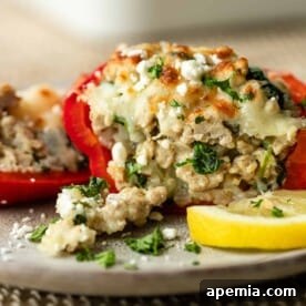 Greek stuffed peppers with ground chicken, spinach, and feta, showcasing the deliciousness of the dish.