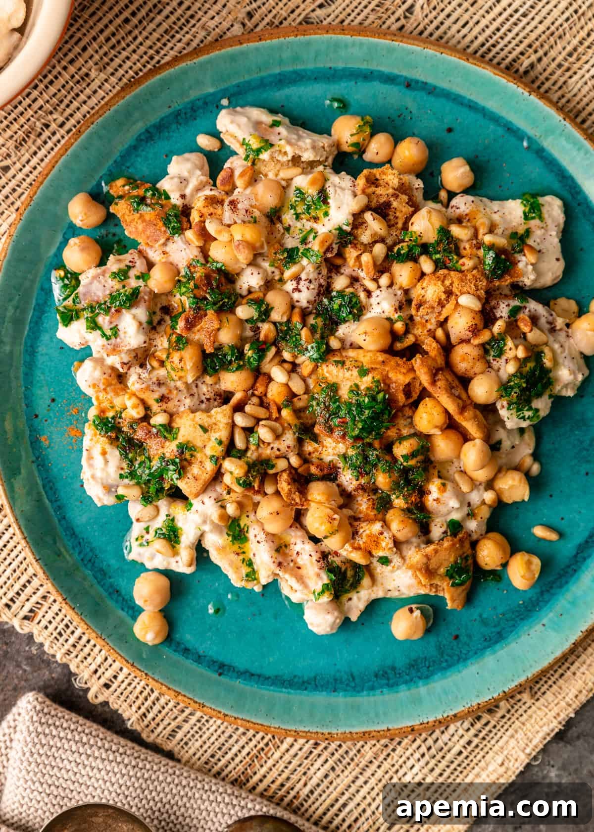 overhead: fattet hummus on blue plate