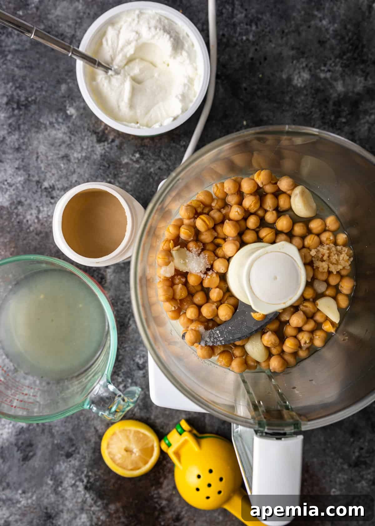 overhead process shot: chickpeas in food processor bowl for fatteh recipe