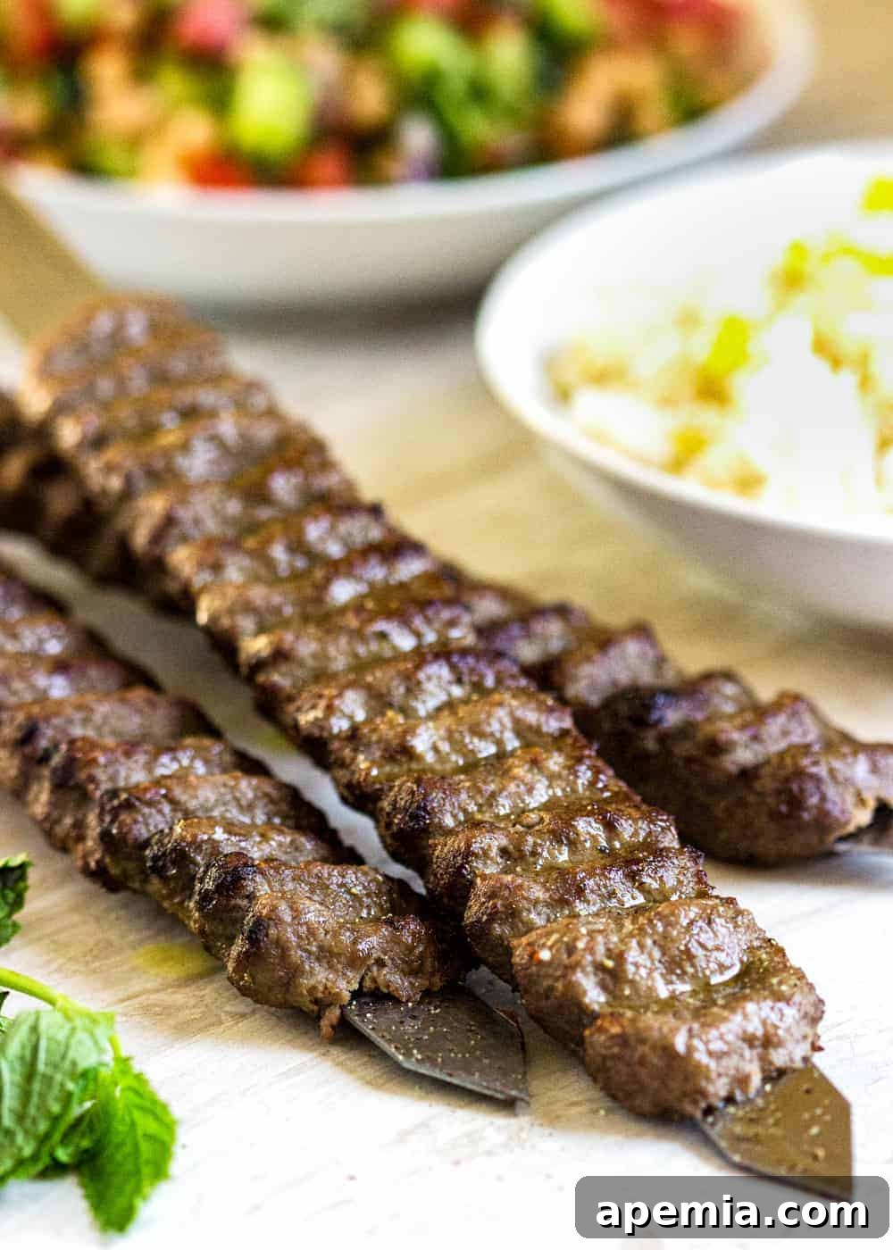 Succulent grilled lamb and beef Koobideh skewers presented beautifully on a wooden table, accompanied by an assortment of vibrant Persian side dishes.