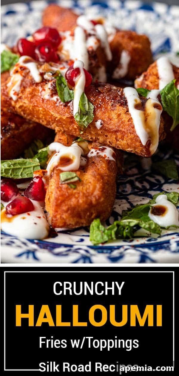 Titled image (and shown): A delicious plate of crunchy halloumi fries with various colorful toppings and dipping sauce.