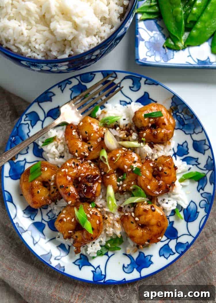 An inviting overhead shot of perfectly cooked honey garlic shrimp, artfully arranged on a serving plate.