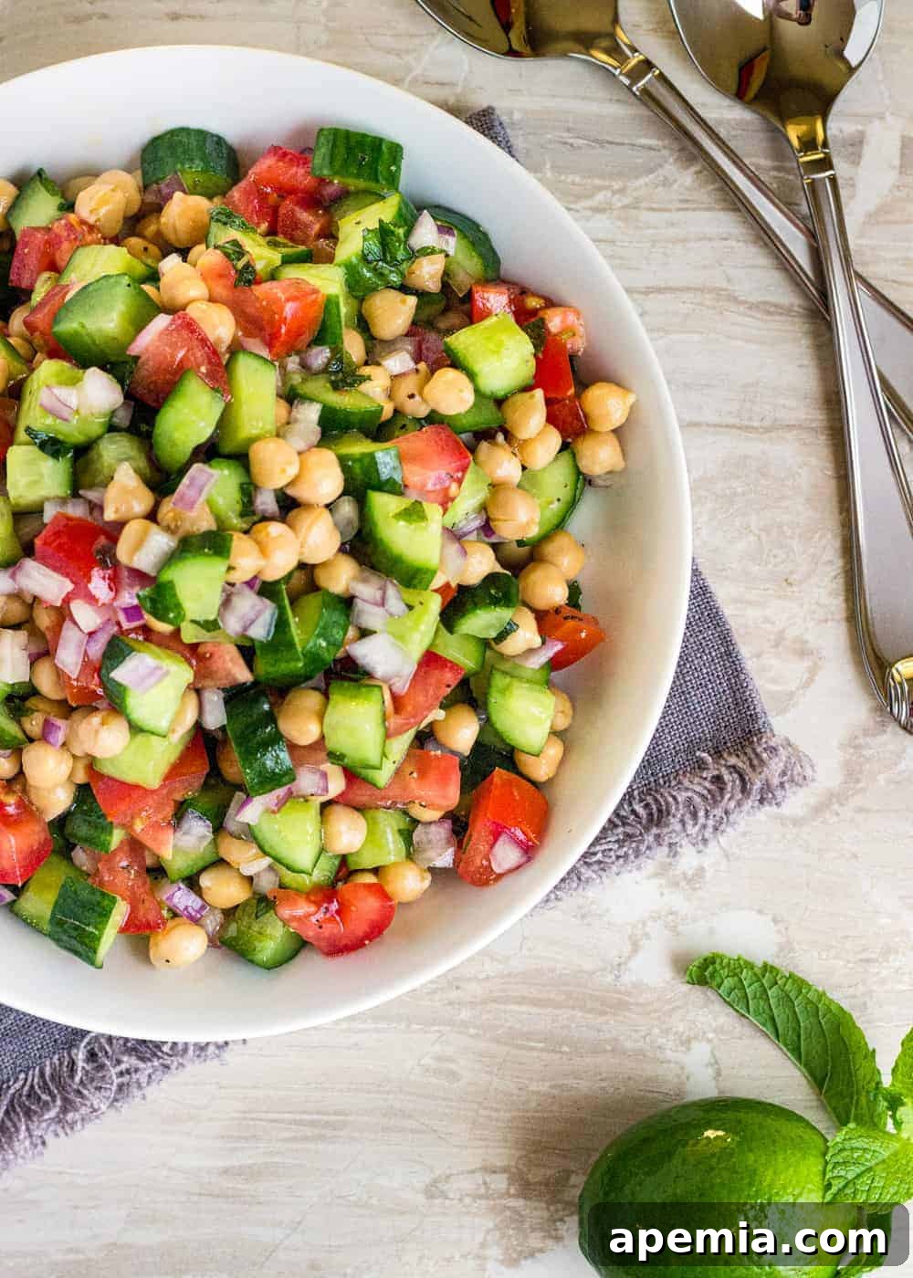overhead photo of a bowl of shirazi salad at a table place setting