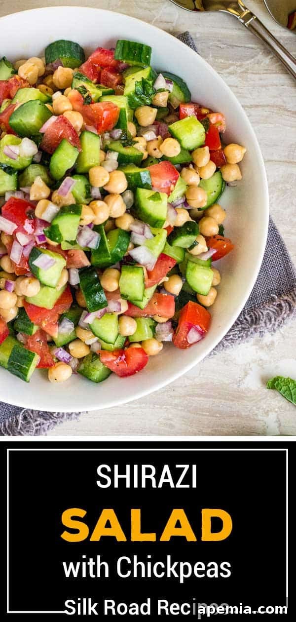 overhead of shirazi salad made of chickpeas, tomatoes, cucumbers