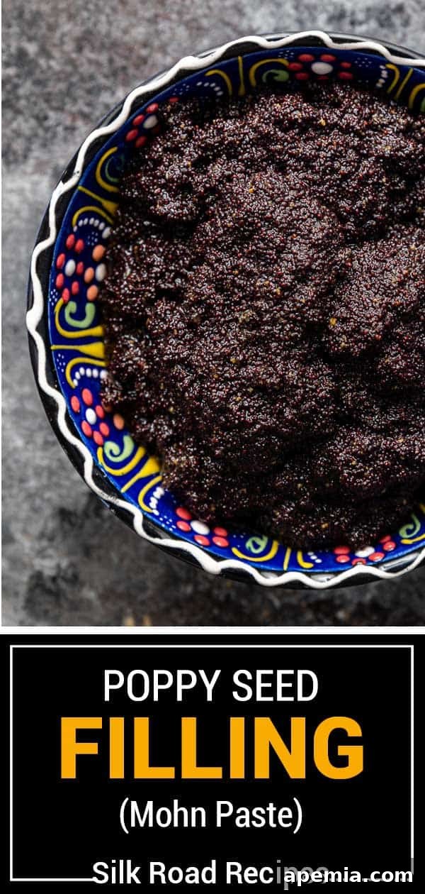 Vertical shot of a jar of homemade poppy seed filling (mohn paste) with a spoon, highlighting its texture and freshness.