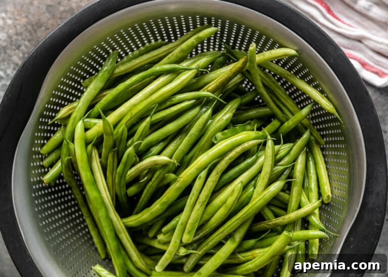 overhead: washed green beans in a strainer