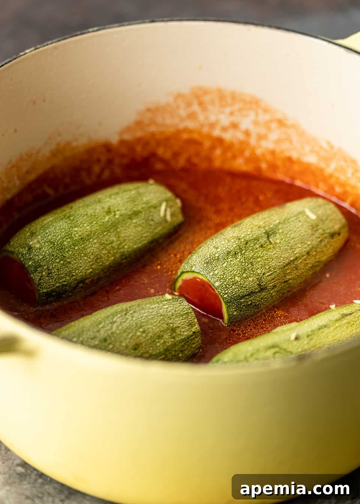 closeup: my stuffed zucchini recipe cooking in a pan