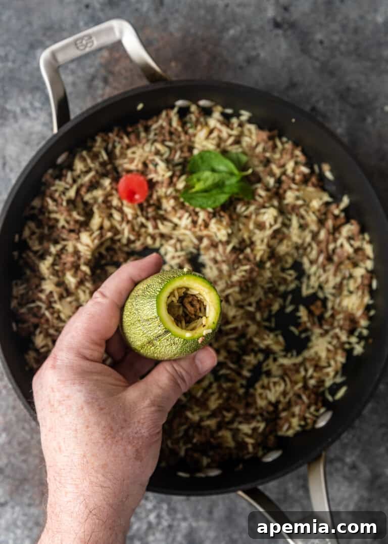 overhead process shot: adding filling to zucchini