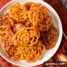 Close-up of freshly fried Jalebi with glistening syrup
