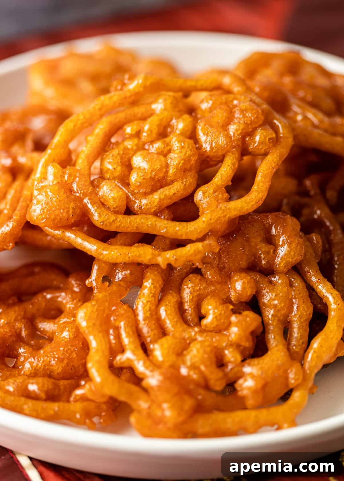 closeup of a plate filled with homemade Indian funnel cake, glistening and inviting