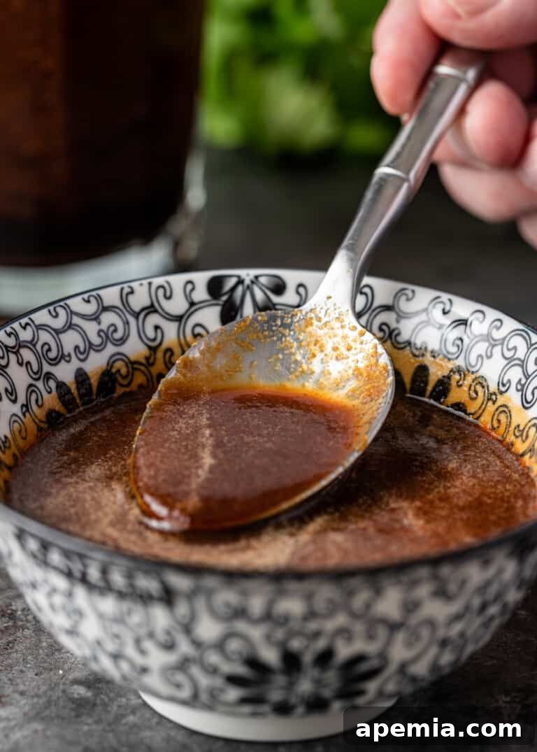 spooning ginger sauce