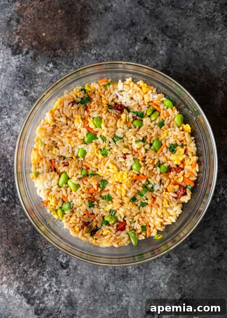 overhead process shot: fried rice pressed in oiled bowl for shaping