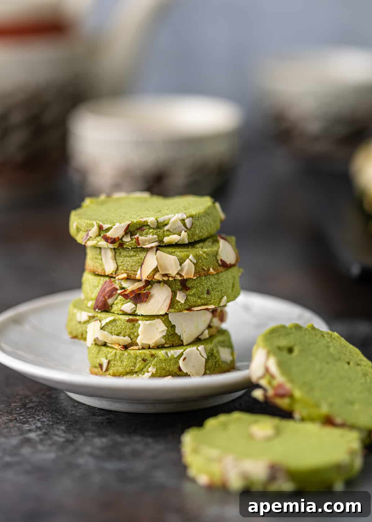 Closeup side view of a perfectly baked green tea shortbread cookie, ready to be served and enjoyed.
