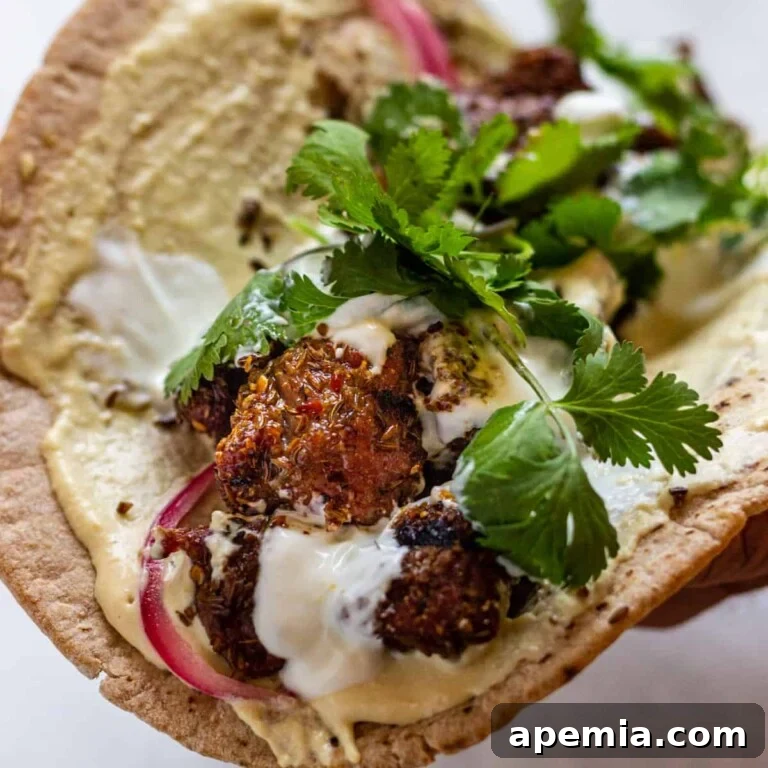 grilled lamb skewers wrapped in a pita