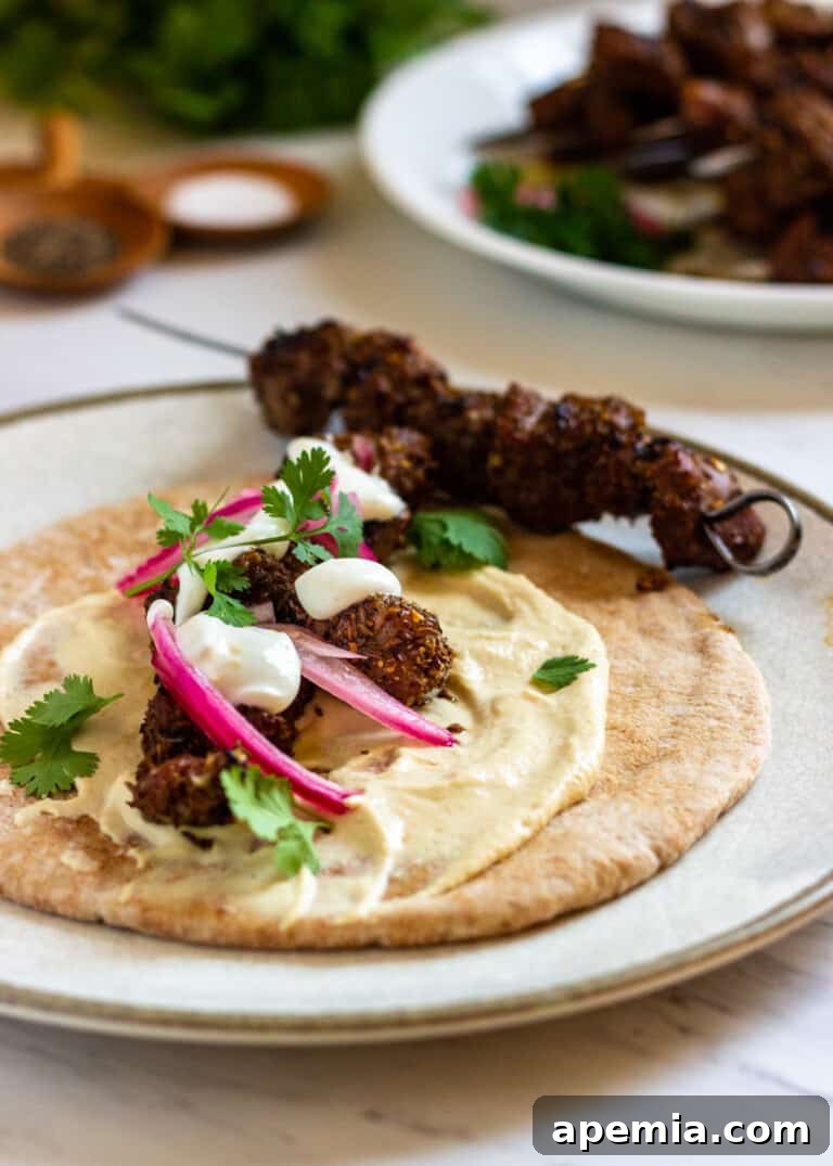 my grilled lamb skewer recipe beside tortilla with lamb