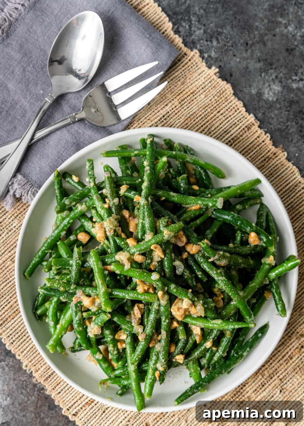 Sesame Garlic Green Beans 7 overhead: beautifully plated Asian green beans with fork and spoon
