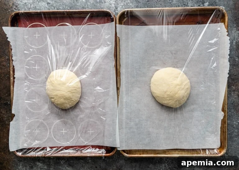 Beloved Turkish Ramadan Pide 16 Two baking sheets with shaped Ramazan Pidesi dough, covered and ready for the final rise.