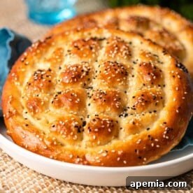 Turkish Ramadan Pide (Ramazan Pidesi) - a soft, round flatbread with seeds.