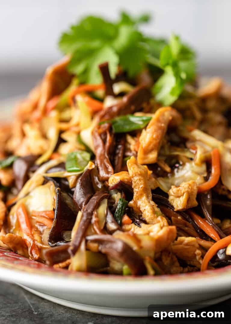 side view of Moo Shu Pork, highlighting the layers of ingredients