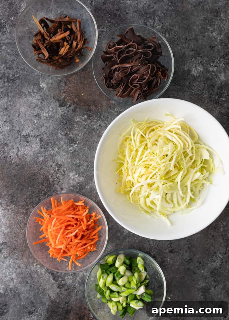 bowls of precisely sliced vegetables for Moo Shu Pork
