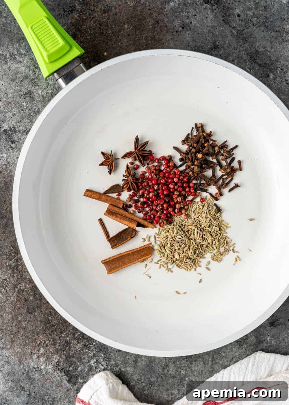 overhead: whole spices in skillet for chinese five spice recipe