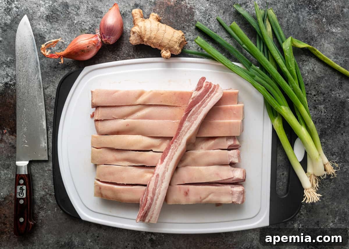 overhead: slices of pork belly on a plate