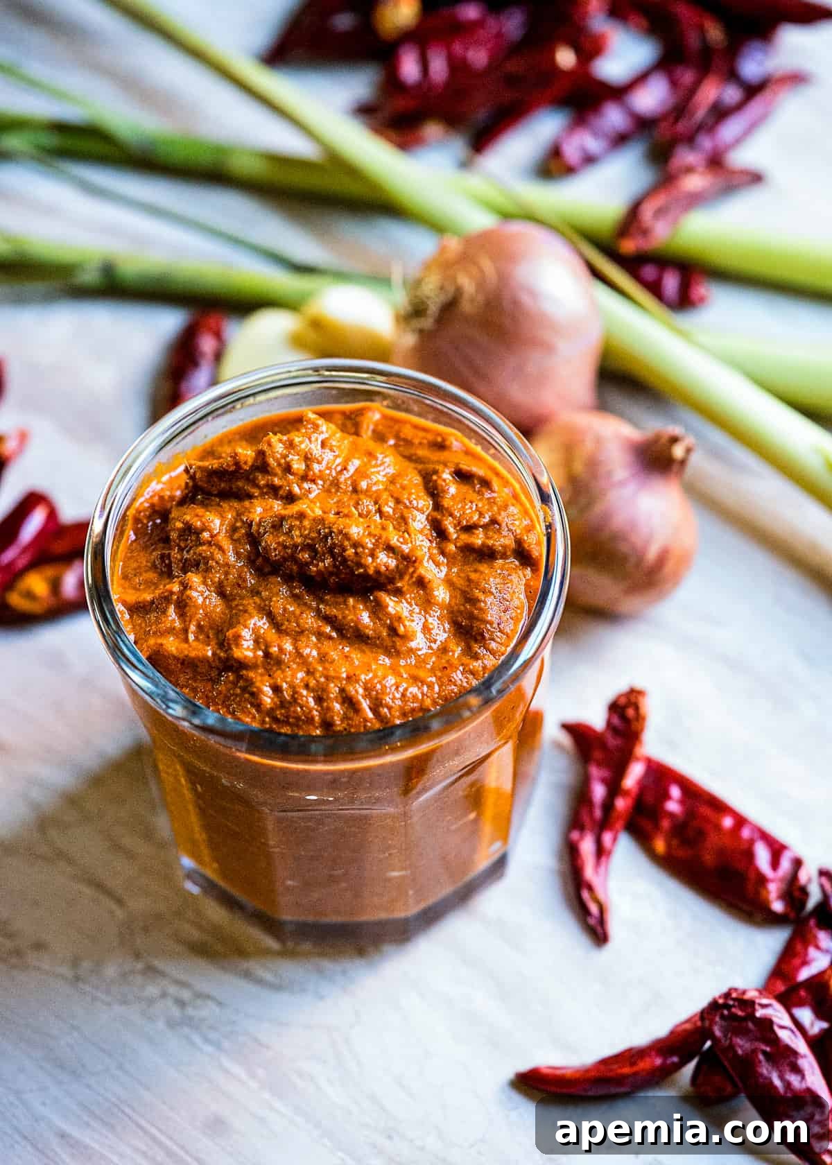 closeup: jar filled with my thai red curry paste recipe, ready for storage