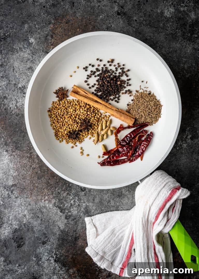 overhead process shot: whole spices for panang curry paste, ready to be toasted and ground