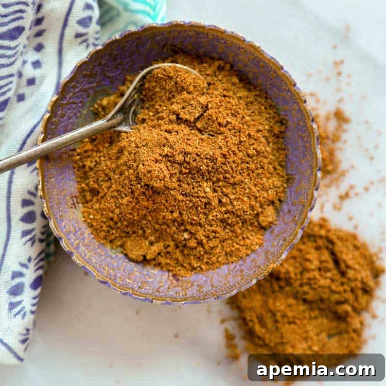 Malaysian Curry Powder in a bowl with a spoon