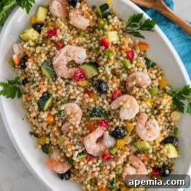 overhead Mediterranean Couscous Salad with Shrimp on platter