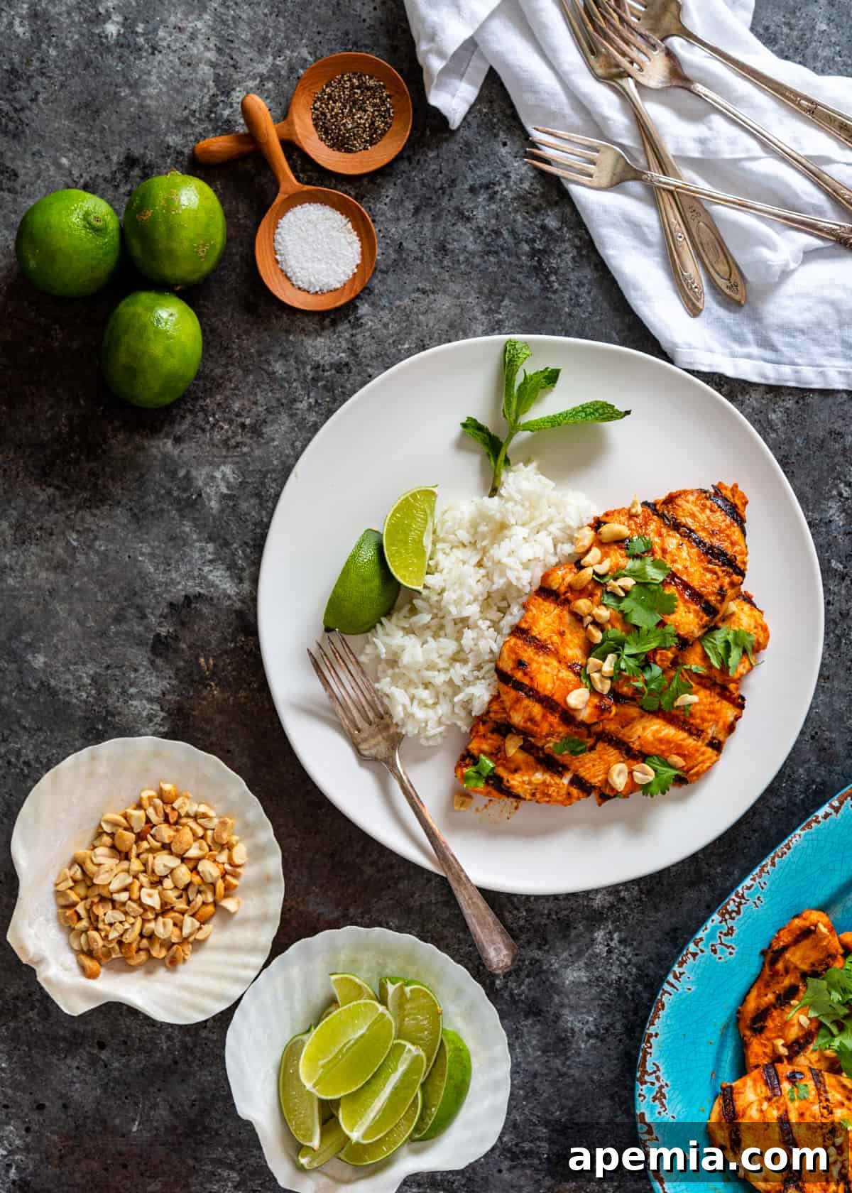 Fragrant Thai Curry Grilled Chicken 6 plate with curry chicken, rice, herbs, and lime wedges