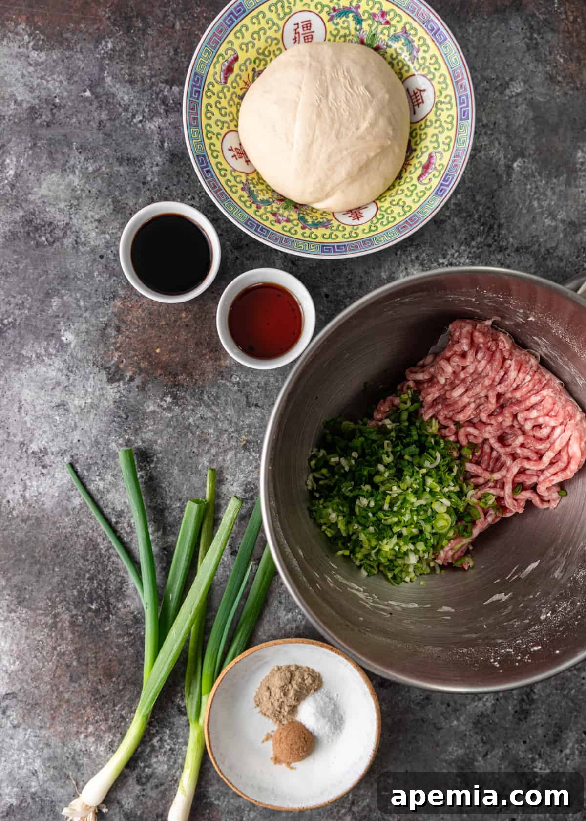 Bowl of savory pork filling for Chinese Meat Pie, mixed with green onions and spices