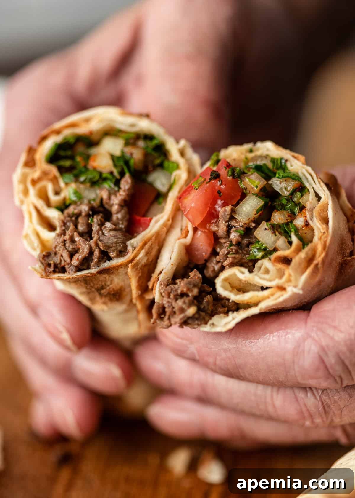 extreme closeup: tantuni wrap sliced in half with fillings showing
