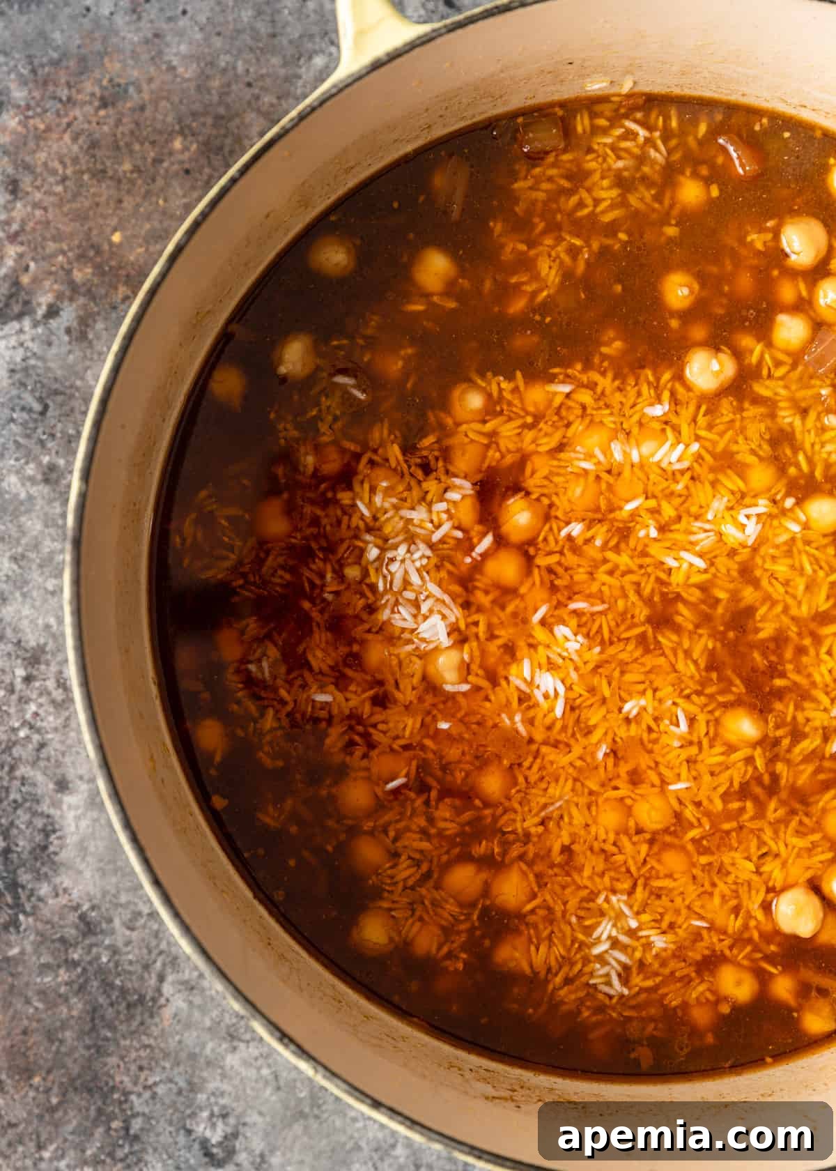 overhead: plov cooking in a large dutch oven