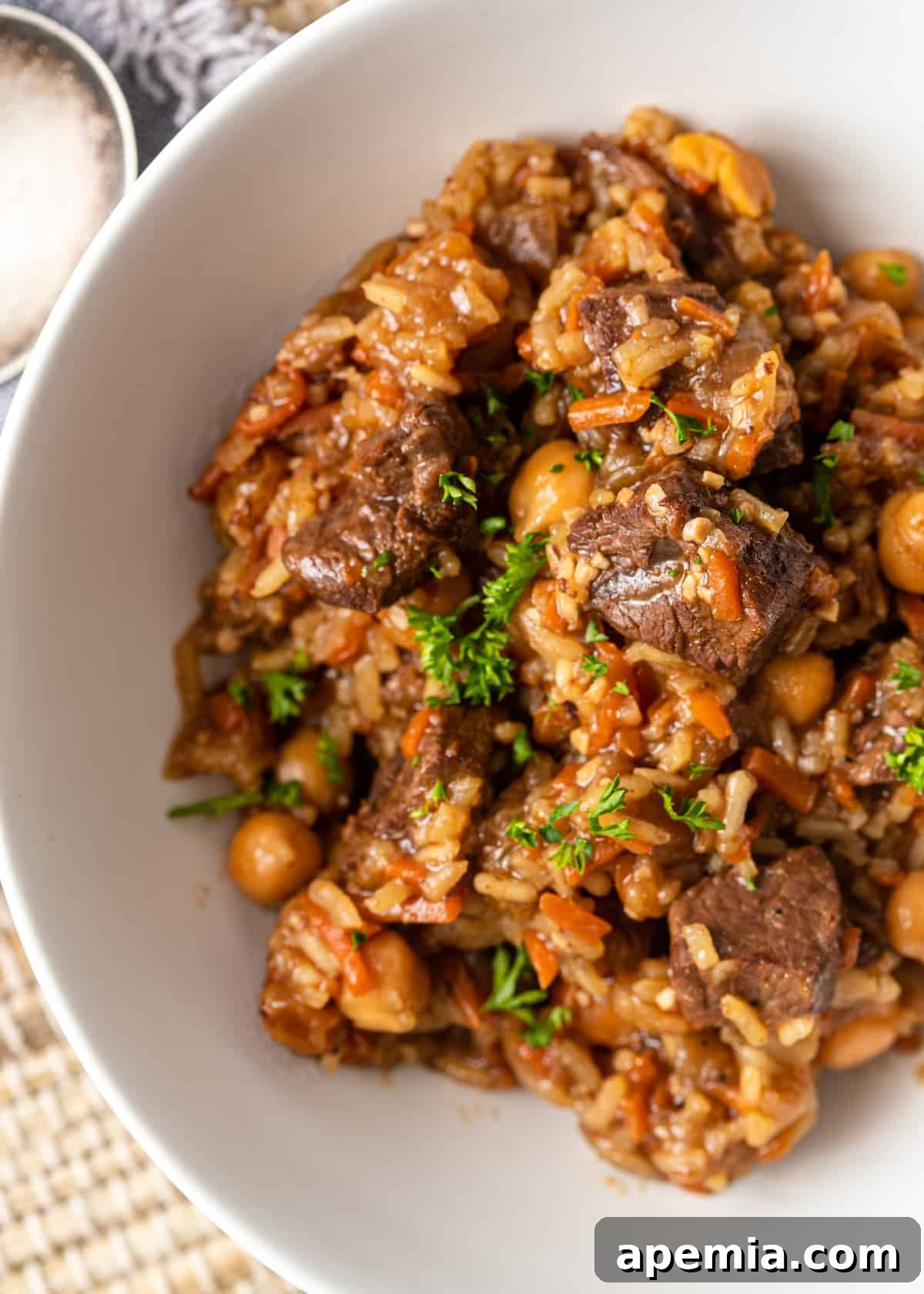 overhead: a serving of my plov recipe in a white bowl