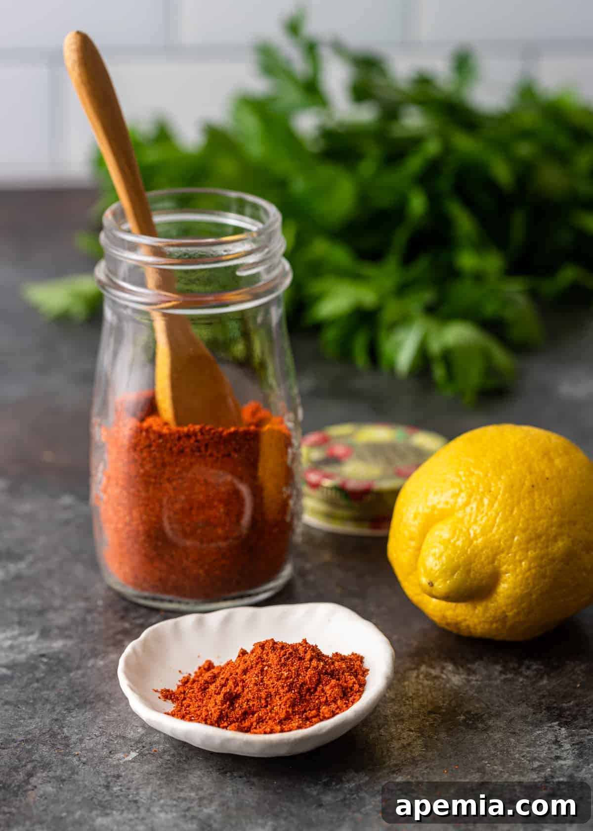 A generous serving of Lemon Harissa Powder displayed on a pristine white plate, showcasing its texture and color.