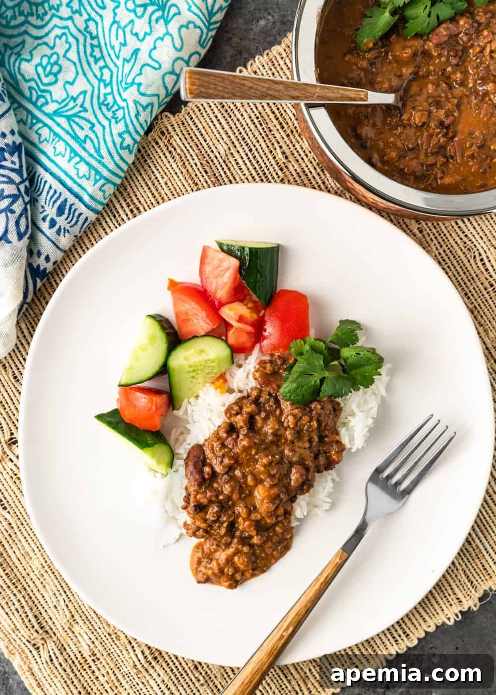 Ultimate Creamy Dal Makhani 5 black dal makhani served over rice with vegetables on white plate