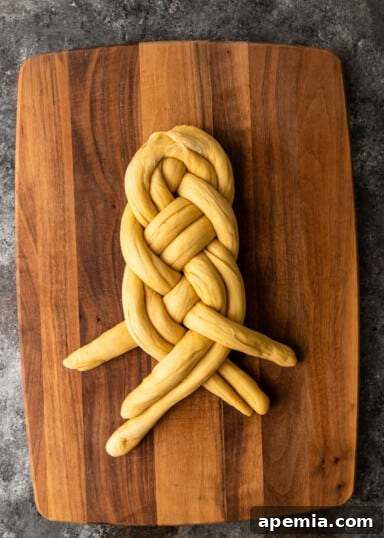 Right pair of ropes crossing over the right single rope.