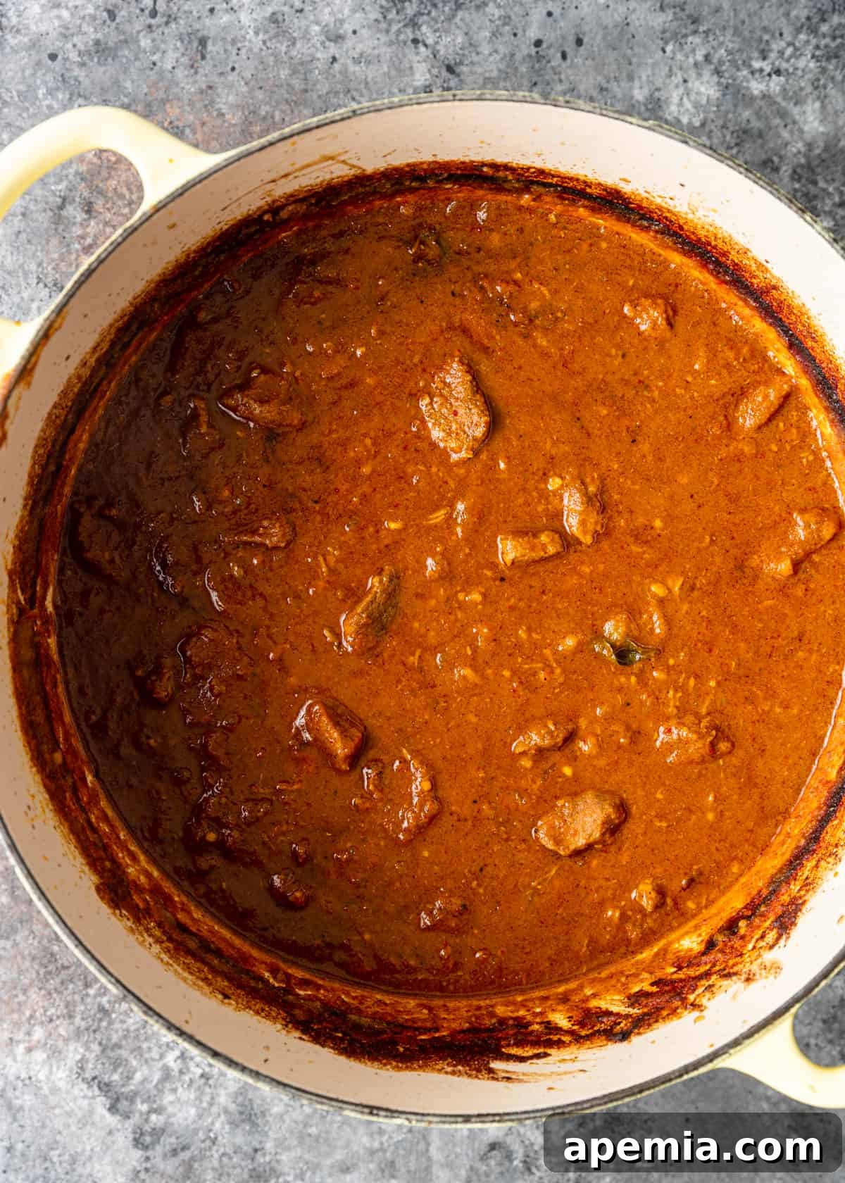 Zesty Goan Lamb Vindaloo 10 overhead process shot: vindaloo recipe ingredients simmering for two hours