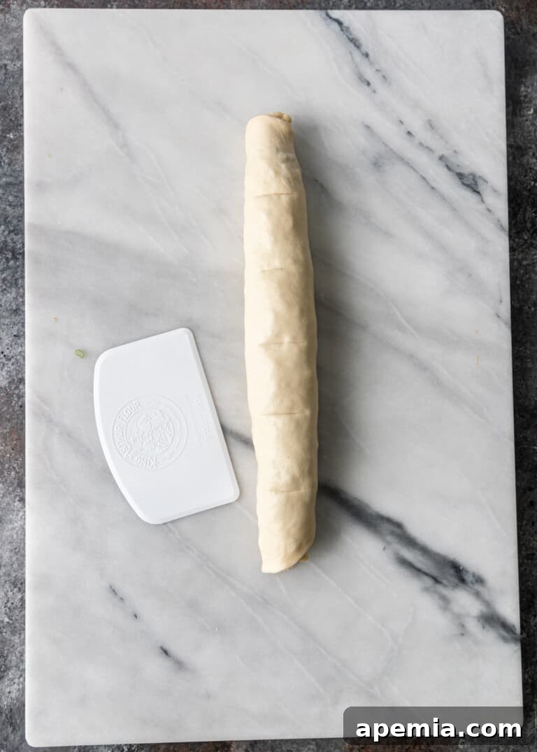 overhead process shot: pressing and sealing the dough roll