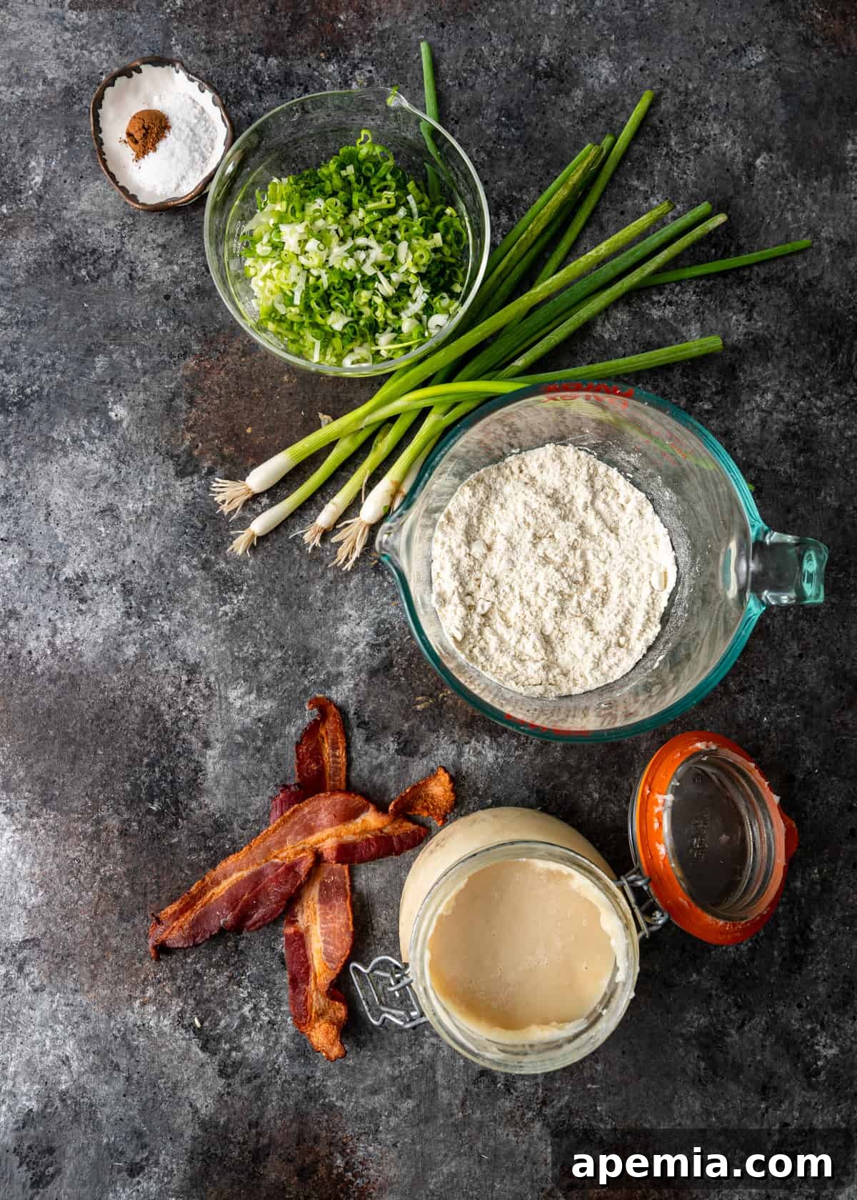 overhead: all ingredients for making spring onion pancakes laid out on a table