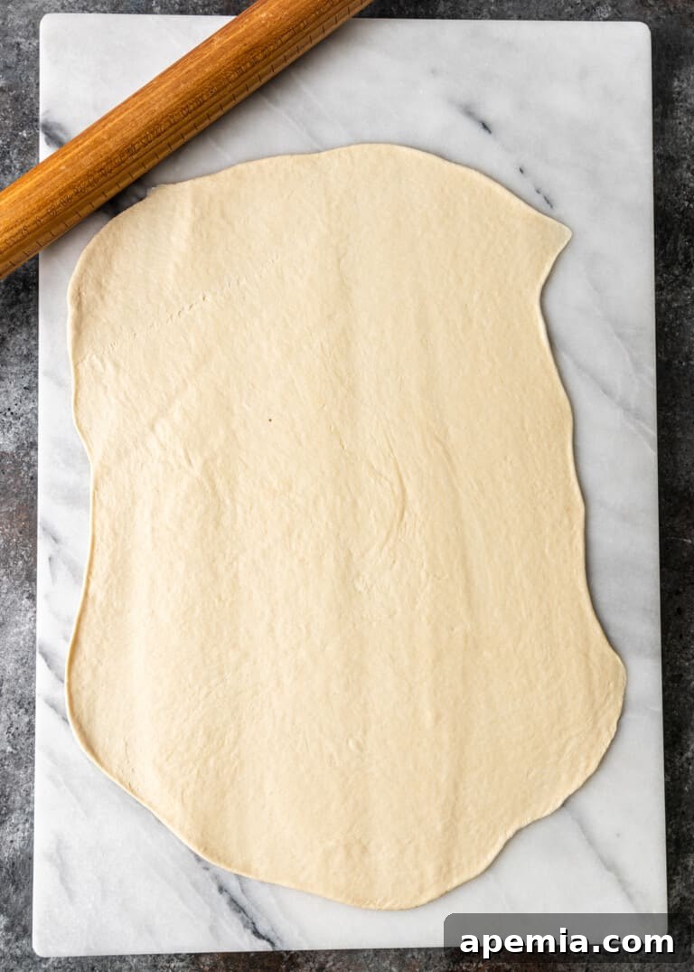 overhead process shot: rolling out dough into a rectangle