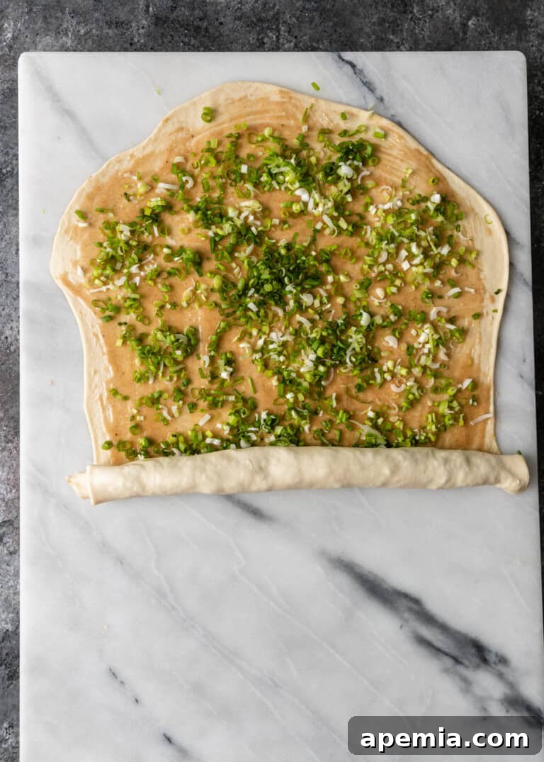 overhead process shot: rolling the dough from the short end