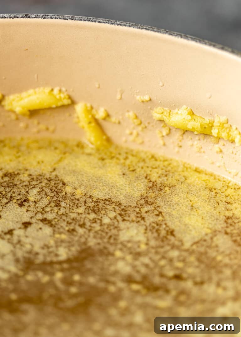 overhead process shot: titled image (and shown) "schmaltz" chicken fat